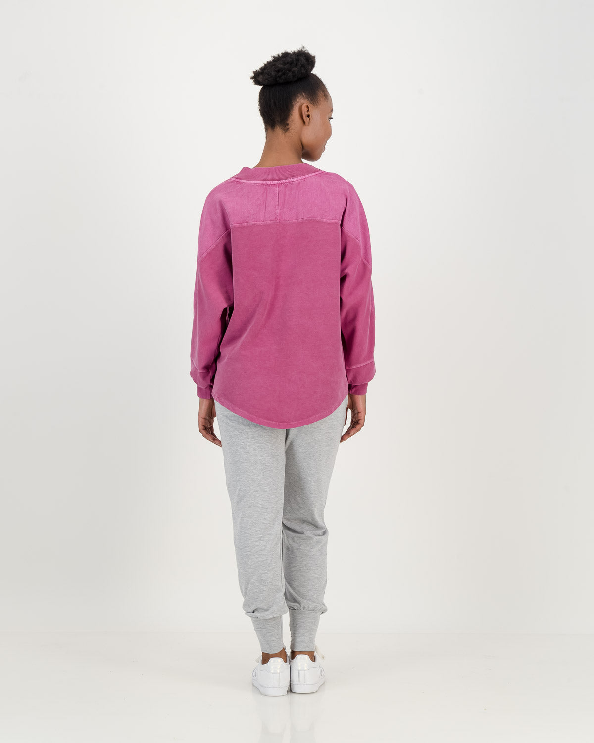 Batwing Overdyed Magenta Sweatshirt, loose fitting with longer back paired with light grey comfy pants