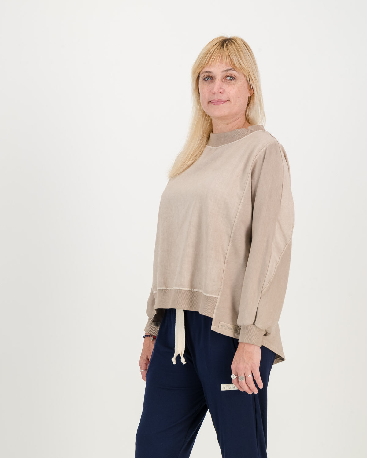 Batwing Overdyed stone Sweatshirt, back hem is dipped and longer than the front. Paired with black comfy pants