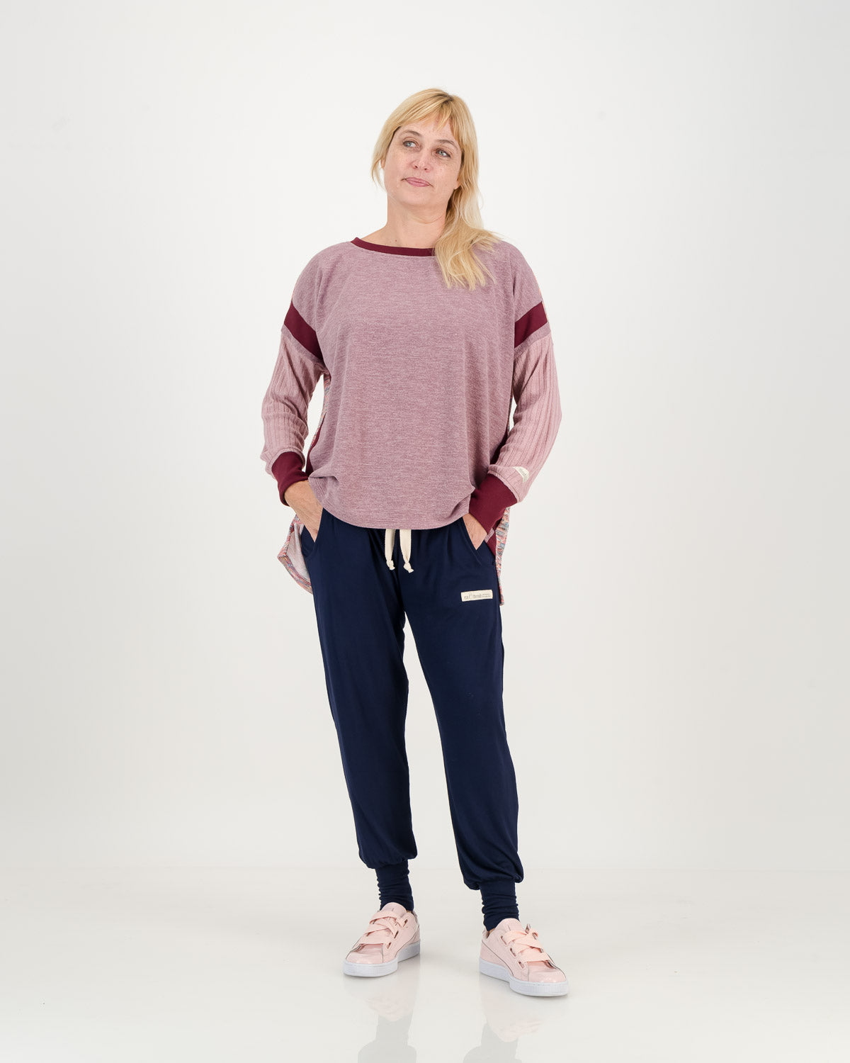 Carefree casual lavender Jersey, boxy shape with longer back, paired with navy comfy pants